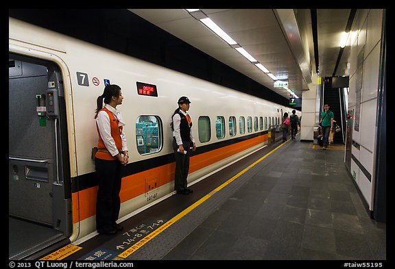 Hostess in front of High Speed Rail (HSR) car. Taipei, Taiwan