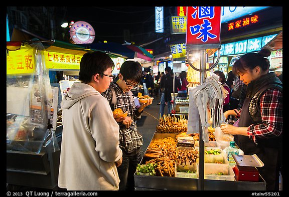 Customer buying foods at Shilin Night Market. Taipei, Taiwan (color)