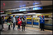 Subway with staff directing passengers. Taipei, Taiwan (color)