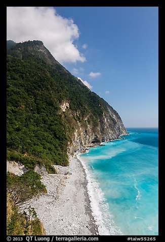 Lush high hills drop into turquoise ocean. Taroko National Park, Taiwan