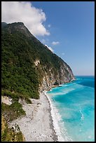 Lush high hills drop into turquoise ocean. Taroko National Park, Taiwan ( color)