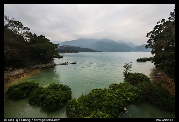 Cove with floating rafts on which plants are being grown. Sun Moon Lake, Taiwan (color)