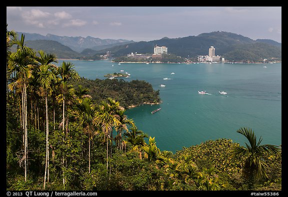 Palm trees, lake, and Sun Moon Lake Village. Sun Moon Lake, Taiwan (color)