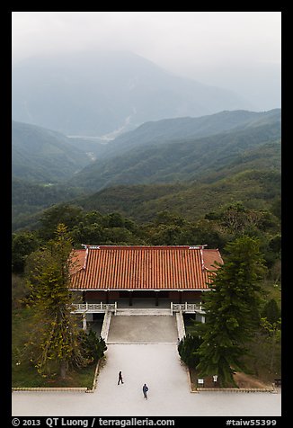 Two people, temple, and misty mountains, Tsen Pagoda. Sun Moon Lake, Taiwan