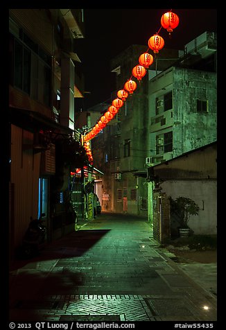 Red paper lanterns glowing in  Nine-turns lane at night. Lukang, Taiwan