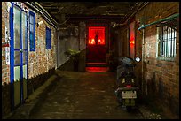 Alley at night with temple altar glowing red. Lukang, Taiwan ( color)