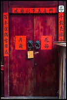 Wooden door traditional lock and chinese inscription on red paper. Lukang, Taiwan (color)