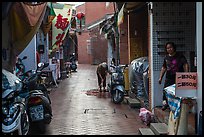 Woman cleaning in alley. Lukang, Taiwan ( color)