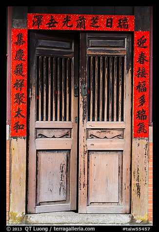 Wooden door with chinese script on red paper. Lukang, Taiwan