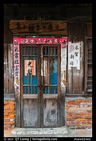 Door with weathered wood and inscriptions. Lukang, Taiwan (color)