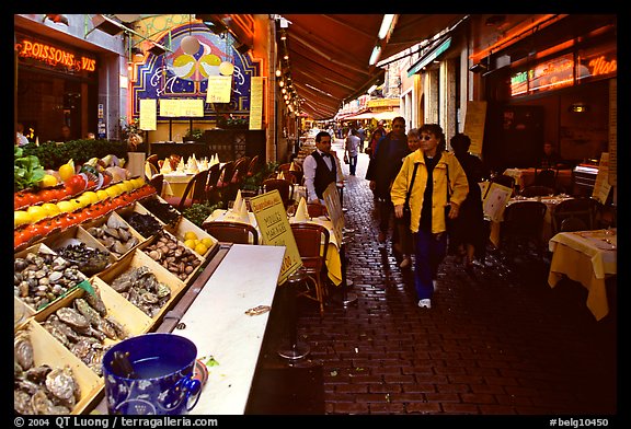 Rue des Bouchers, a narrow cobbled street lined with restaurants. Brussels, Belgium