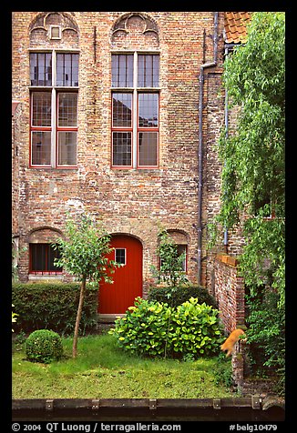 Brick house with small garden by the canal. Bruges, Belgium