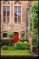 Brick house with small garden by the canal. Bruges, Belgium (color)