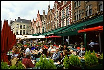 People in restaurants on the Markt. Bruges, Belgium (color)