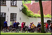 Bicylists in Courtyard of the Begijnhof. Bruges, Belgium ( color)