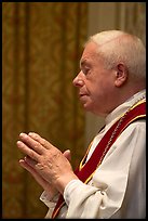 Priest in the Heilig-Bloedbasiliek. Bruges, Belgium (color)