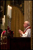 Priest in the the Basilica of Holy Blood. Bruges, Belgium