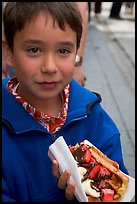 Boy eating a Belgian waffle. Brussels, Belgium