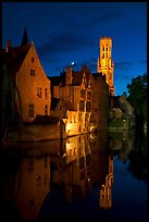 Old houses and belfry Quai des Rosaires, night. Bruges, Belgium