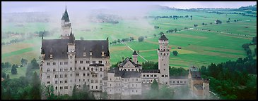 Neuschwanstein castle and fog. Bavaria, Germany (Panoramic color)
