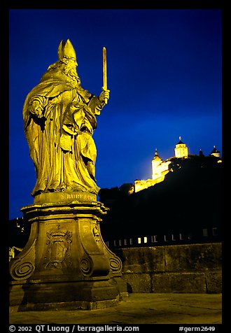 Saint Killian statue on  Alte Mainbrucke (bridge) and Festung Marienberg (citadel) at night. Wurzburg, Bavaria, Germany