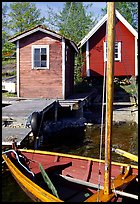 Boat and cabins. Gotaland, Sweden (color)