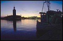 Fishing boat and Stadshuset. Stockholm, Sweden