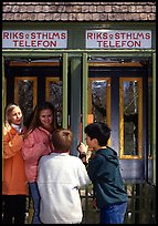 Swedish kids in a phone booth. Stockholm, Sweden ( color)