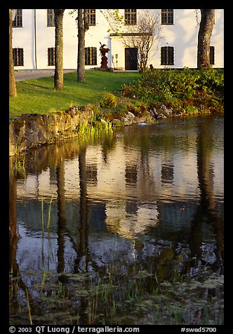 Building reflected in a lake, Skansen. Stockholm, Sweden (color)