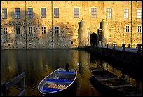 Boat and moat of Vadstena slott. Gotaland, Sweden (color)