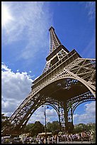 Eiffel tower and sun with crowds at base. Paris, France ( color)
