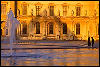 Basin and projected shadow of the Pei pyramid on the Louvre at sunset. Paris, France