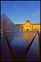 Pyramid and triangular basin in the Louvre, sunset. Paris, France ( color)