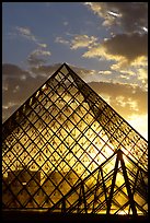 Louvre pyramid transparent at sunset. Paris, France ( color)