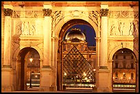 Arche de triomphe du Carousel, Louvre, and Pyramid at night. Paris, France