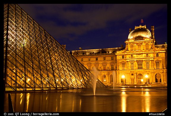 Pyramid, basin, and Louvre at night. Paris, France (color)