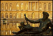 Statue, basin, and facade, late afternoon, Versailles Palace. France (color)