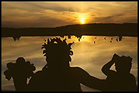 Sunset over a basin in the Versailles palace gardens. France