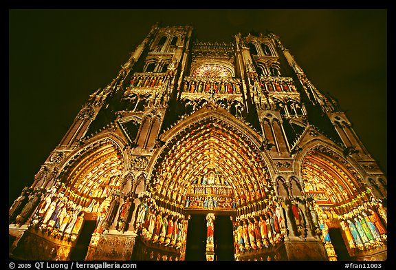 Looking up Notre Dame Cathedral laser-illuminated to recreate original colors, Amiens. France