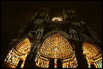 Looking up cathedral with doors laser-illuminated to recreate original colors, Amiens. France