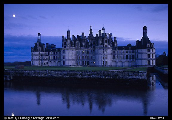 Chambord chateau at dusk with moonrise. Loire Valley, France