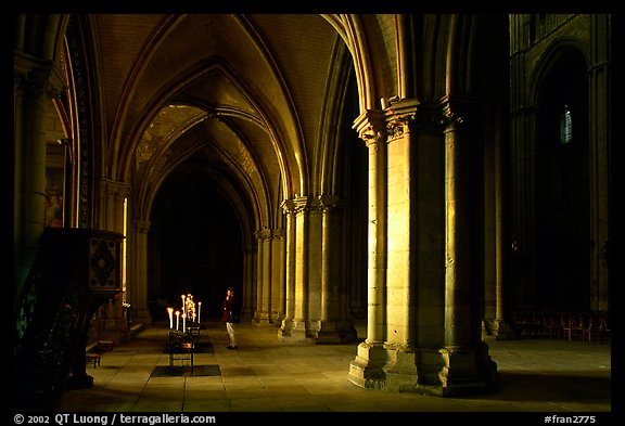 Worshiper inside the Saint-Etienne Cathedral. Bourges, Berry, France