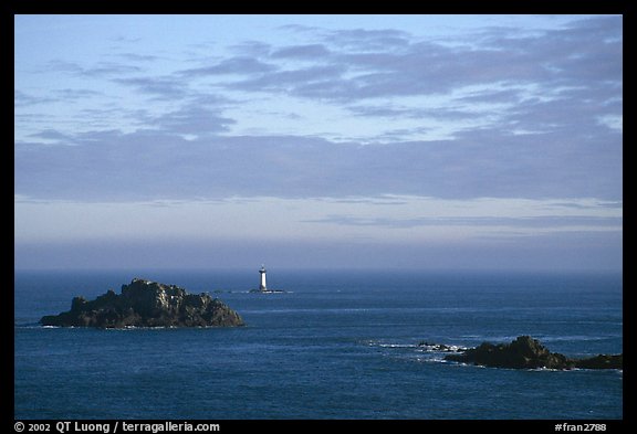Islets and lighthouse on the coast. Brittany, France