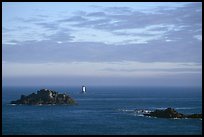 Islets and lighthouse on the coast. Brittany, France (color)