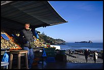 Oyster stand and vendor in Cancale. Cancale oysters are reknown in France. Brittany, France ( color)