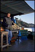 Oyster stand and vendor in Cancale. Brittany, France (color)