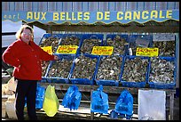 Oyster stand and vendor in Cancale. Brittany, France ( color)