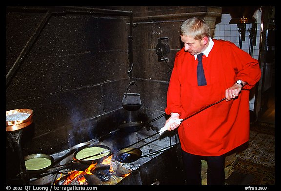 Baking the famous Omelette de la mere Poularde at the eponymous restaurant. Mont Saint-Michel, Brittany, France (color)