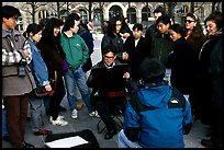 Sketch drawer surrounded by onlookers. Paris, France