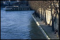 Walking on the banks of the Seine on the Saint-Louis island. Paris, France (color)